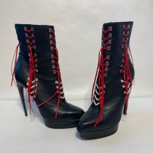 Alexander MQueen Black leather red lace up horn heel ankle boots.